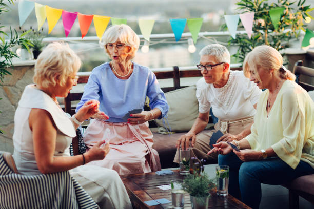 istock Senior Women Playing Cards 1021009656