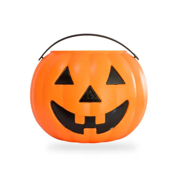 Photo of Pumpkin basket isolated on white background (clipping path) for kid collecting candy Jack o'lantern basket , trick or treat on Halloween day celebration