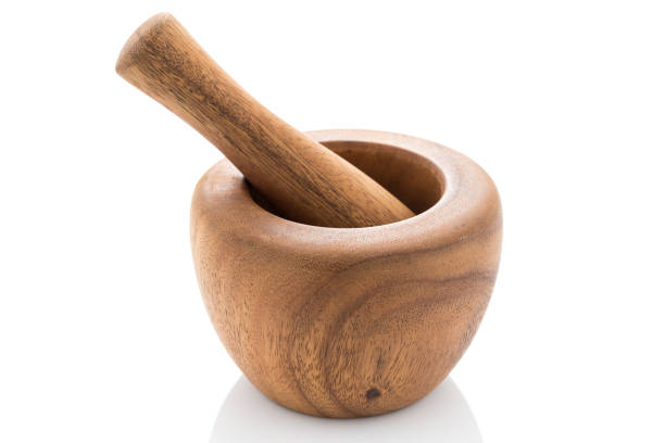 istock wood mortar and pestle on white background 1021025636