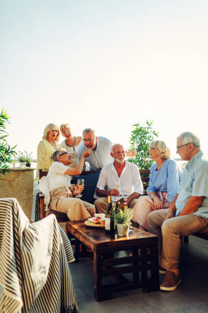 istock Senior Friends Having Fun On Rooftop 1021025764