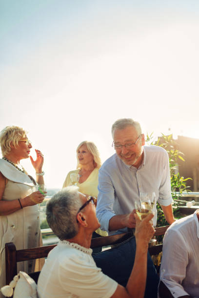 istock Senior Friends Having Fun On Rooftop 1021025782