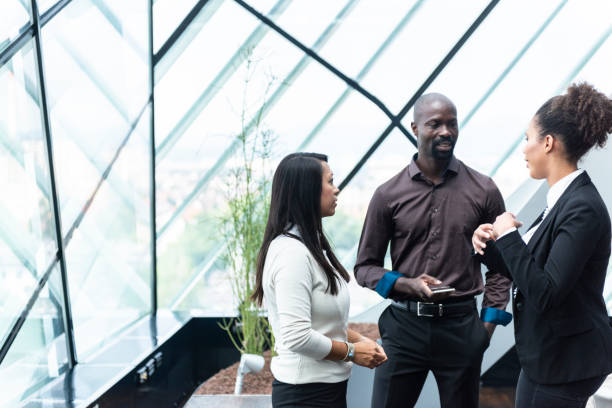 istock Businessman discussing with colleagues in office 1021031724