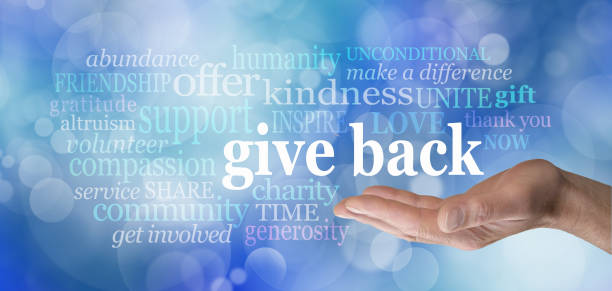 GIVE BACK word tag cloud male hand with the words GIVE BACK floating above surrounded by a word cloud against a blue bokeh background charitable giving stock pictures, royalty-free photos & images
