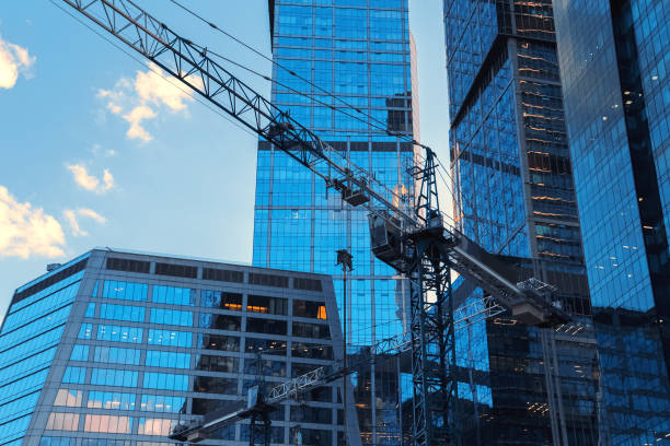 istock Crane construction bricks concrete building in city downtown skyscrapers 1021038296