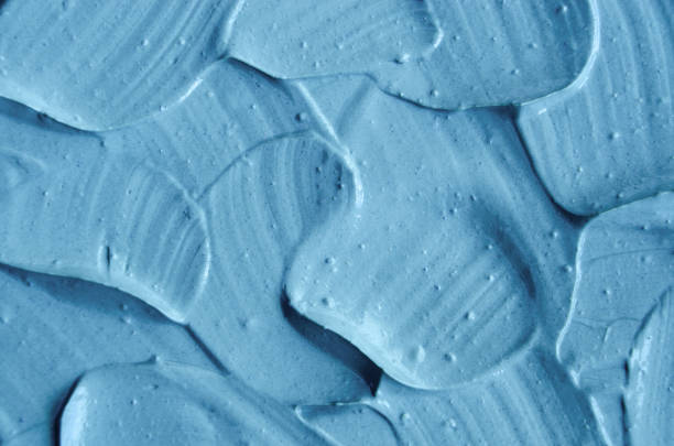 istock Blue cambrian cosmetic clay (facial mask, cream, body scrub) texture close up. Abstract background with brush strokes. 1021041084