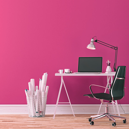 Workdesk with decoration on hardwood floor in front of empty fuchsia wall with copy space. 3D rendered image.