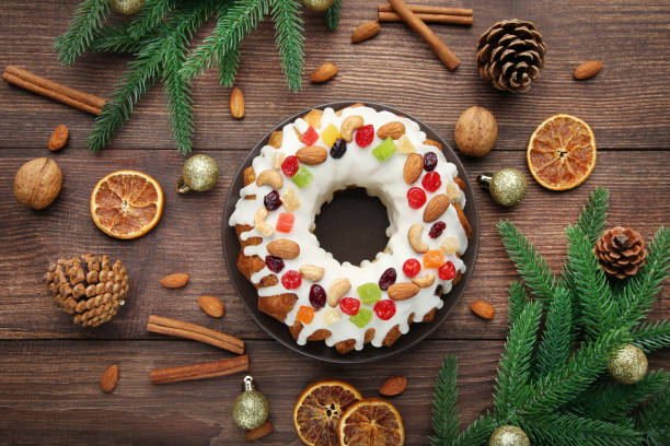 istock Bundt cake with fir-tree branches, cinnamon and dried oranges on wooden table 1021049080