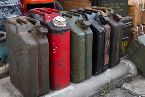 The plastic fuel can next to the car symbolizes the crisis of running out of fuel and an empty tank in the car