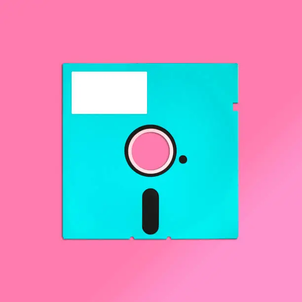 Nostalgic image of a 80s obsolete floppy computer disk (5.25 inch), isolated and presented in punchy pastel colors, with a blank label for creative customization