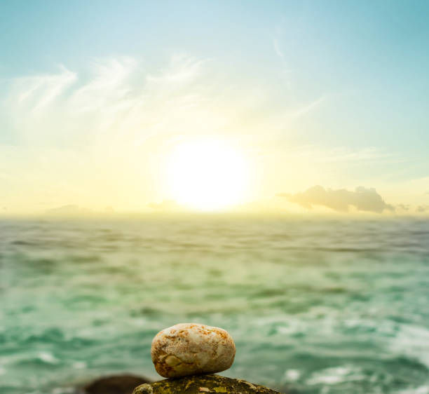 istock stone on a sea coast at the sunset 1021078240