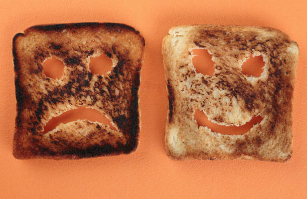 istock Happy and sad toast on acutting board 1021083434