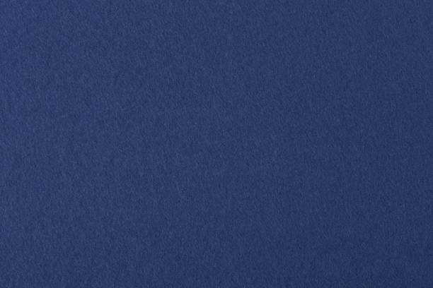Dark blue colored felt texture background on macro Dark blue colored felt texture background. High resolution photo. felt textile stock pictures, royalty-free photos & images