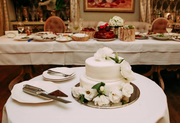 istock celebratory cake white on a table with cutlery 1021086150
