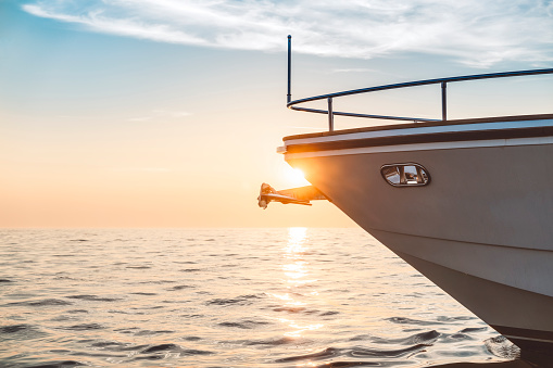 Yacht sailing on the sea in sunset