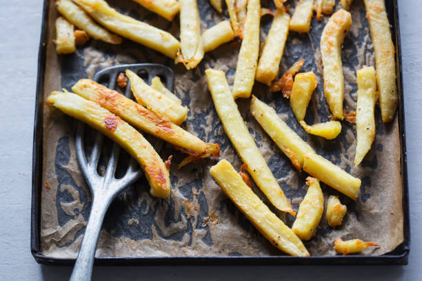 istock Roasted parsnip with parmesan on baking tray 1021090570