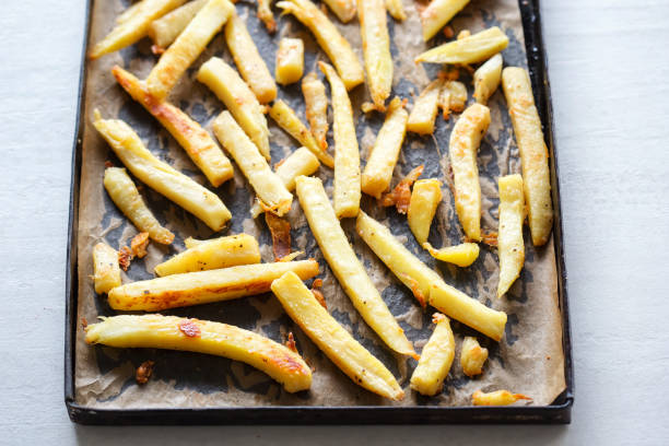 istock Roasted parsnip with parmesan on baking tray 1021090574