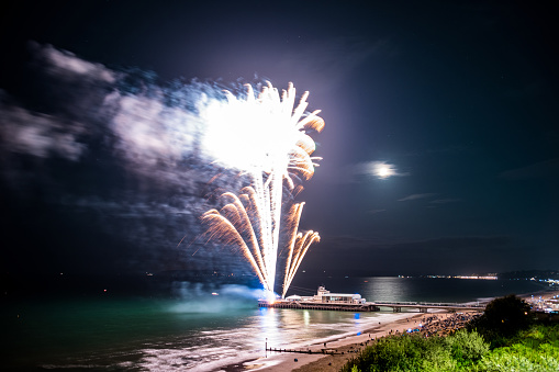 Bournemouth at night with a fireworks display from the pier