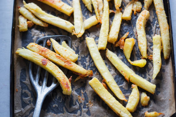 istock Roasted parsnip with parmesan on baking tray 1021093286