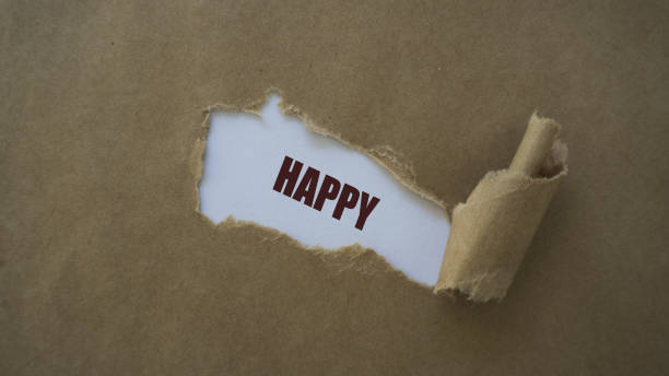 istock happy written on torn paper 1021093800