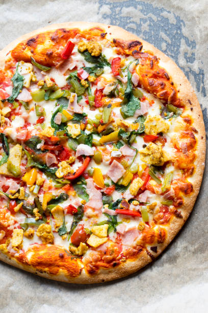 istock Pizza with chicken, bacon and vegetables 1021096980