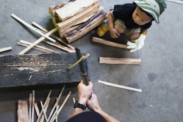 Toddler holding a toy hammer in hand isolated