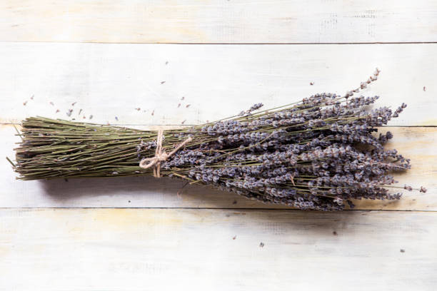 istock Bunches of lavender on wooden table 1021107868