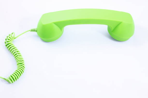 istock Phone with green tube on a white background retro. 1021111062