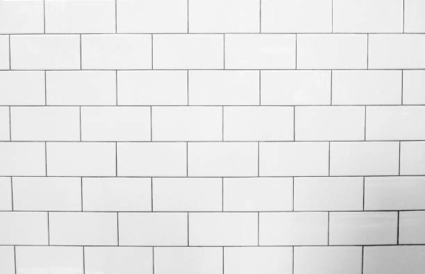istock Abstract weathered modern white bricks wall background stucco in rural room 1021129724