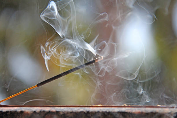Free Stock Photo of A incense stick with smoke coming out of it ...