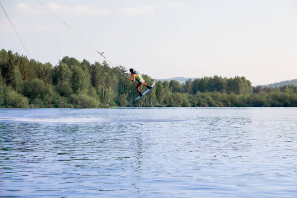 istock Young man riding wakeboard on a lake 1021132768