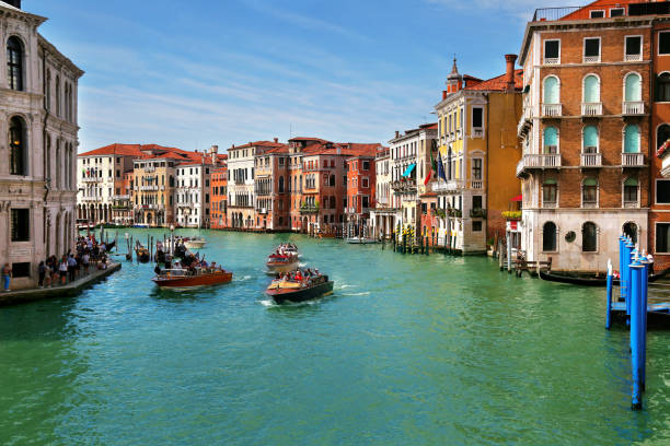 View of Grand Canal with Gondolas and Boats with tourists in Venice, Italy stock photo