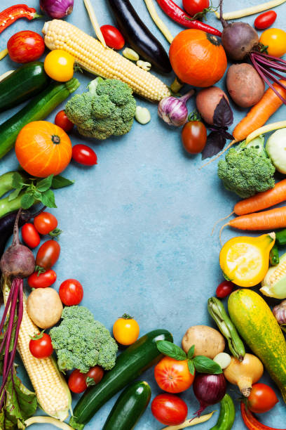 istock Autumn harvest from organic root and farm vegetables on blue table top view. 1021145102