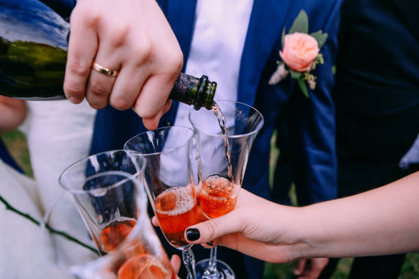istock groom wine bottle goblet holiday friends 1021155272