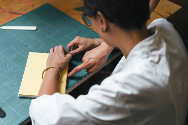 istock Young adult woman making a notebook 1021156074