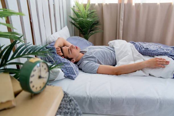 istock Man waking up late for work, he overslept 1021166100