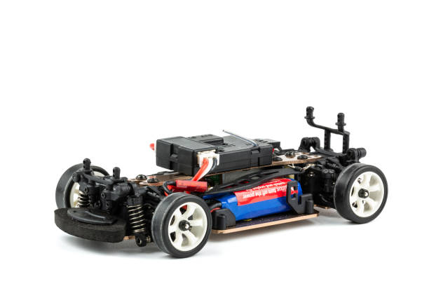 istock Front view of RC drift car (Radio-controlled) without body isolated on white background. (This toy has some dust from children playing) 1021166546