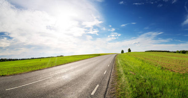istock Road panorama on sunny spring day outdoors 1021178200