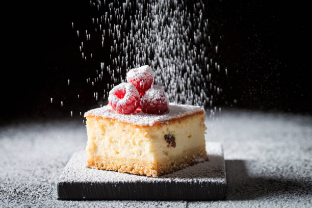 istock Falling powdered sugar on cheesecake with raspberries 1021180960