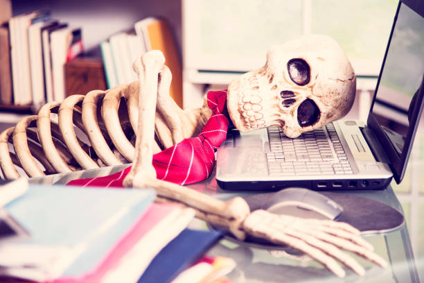 istock Skeleton businessman worked to death in office. 1021181122