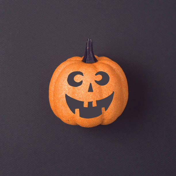 istock Halloween holiday concept with jack o lantern glitter pumpkin decor 1021184476