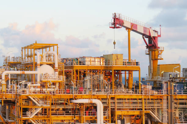 istock Crane construction on Oil and Rig platform for support heavy cargo. Transfer cargo or basket on work site, Heavy industry, heavy job on the oil and gas platform, Offshore operation on the platform. 1021202052
