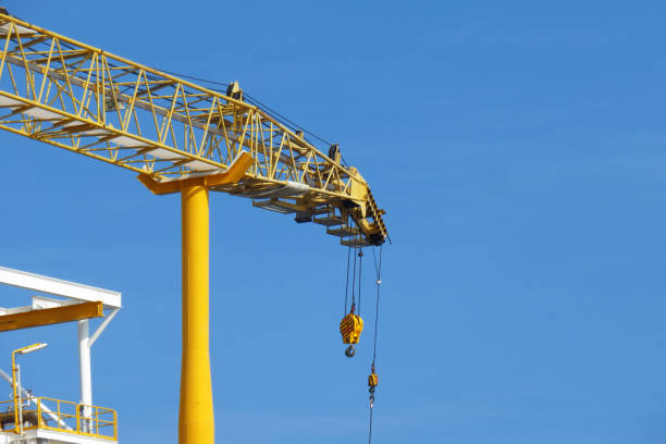 istock Crane construction on Oil and Rig platform for support heavy cargo. Transfer cargo or basket on work site, Heavy industry, heavy job on the oil and gas platform, Offshore operation on the platform. 1021202054