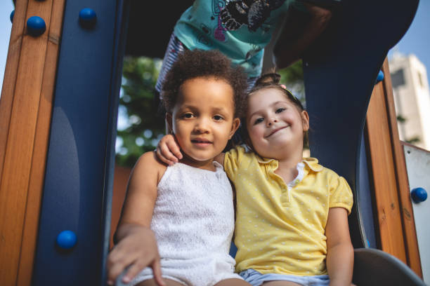 istock Lovely siblings having fun on a playground 1021202058