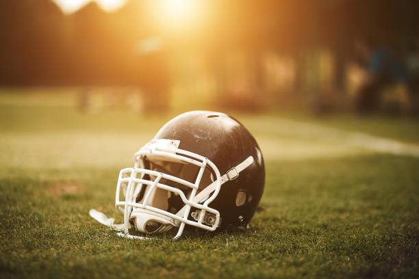 istock Football Helmet on Field 1021207268