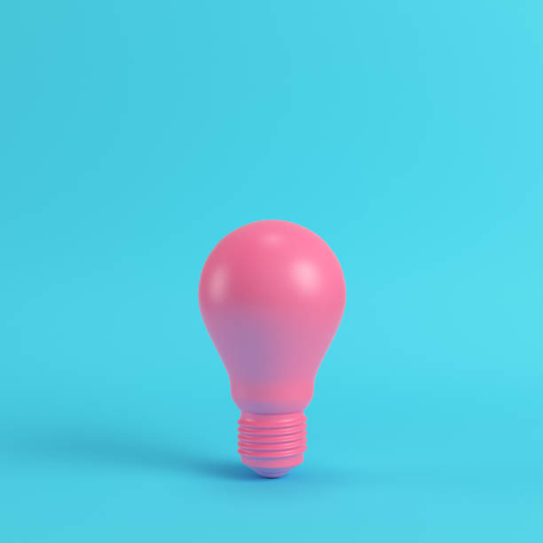 istock Pink light bulb on bright blue background in pastel colors. Minimalism concept 1021210538