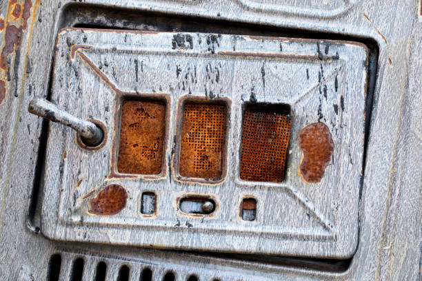 Door of wood burning stove close up. Interesting colors. Image shot 5D Mark4, 100 ISO, EF 100mm f/2.8L Macro IS USM lens.