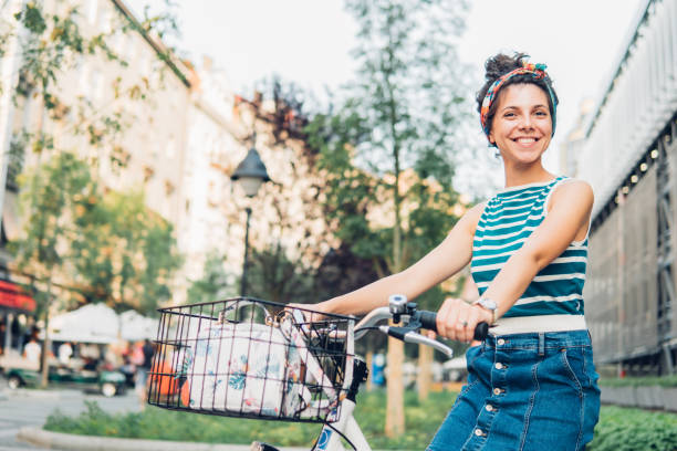 istock Joyful girl on a bicycle 1021228900