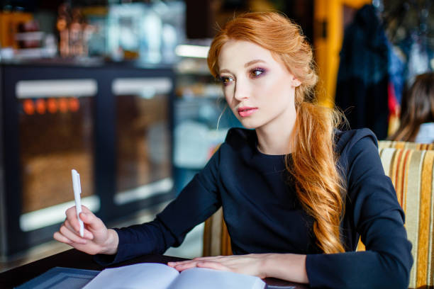 istock Young woman studying in a cafe. 1021239876