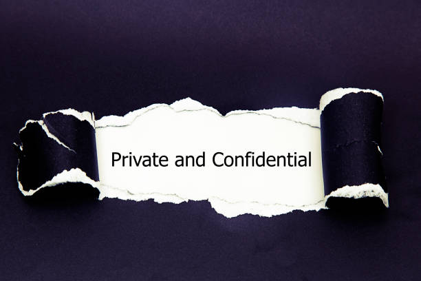 istock The word Private and confidential appearing behind torn paper. 1021241068