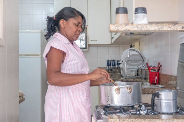 istock Brazilian maid cooking 1021252976